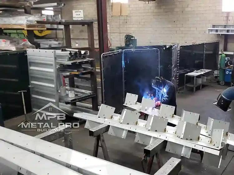 Home 14 worker at a steel factory welding steel together
